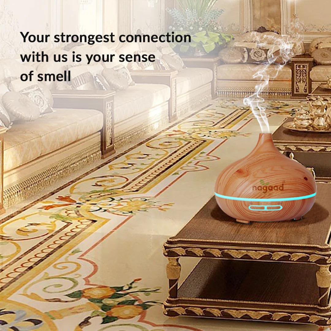 Green palm leaf beside blank white cards on a plain background.